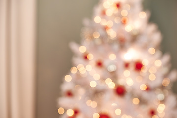 Image showing Christmas, tree and ornaments in living room with blur, holiday or preparation for festive season. Morning, bokeh and tradition for decoration, xmas and December winter vacation in apartment
