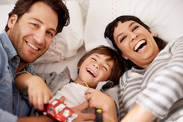 Image showing Family, portrait and kid playing in living room together for bonding, having fun and entertainment in home. Childhood development, happy man and woman with child for quality time, love and toys