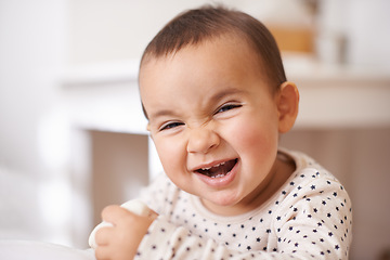 Image showing Baby, toddler portrait and laugh in home, childhood and smile for enjoyment or fun in bedroom. Girl, kid and happy for child development and relax by bed, satisfaction and face for humor or silly