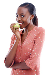 Image showing Black woman, portrait and eating apple for health, nutrition and diet with food on white background. Detox, vegan and fruit for vitamins, fiber and wellness in studio with organic snack for meal