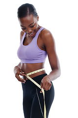 Image showing Fitness, tape measure and waist with happy black woman in studio isolated on white background for weight loss. Exercise, smile and diet with young sports model training for health or nutrition