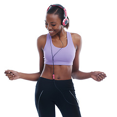 Image showing Fitness, music and smile with happy black woman in studio isolated on white background for radio. Exercise, dance and headphones with confident young sports model training for health or wellness