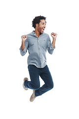 Image showing Happy, excited and man jumping in studio with good news, winning and job promotion celebration. Smile, cheering and young male person with enthusiasm for positive attitude by white background.