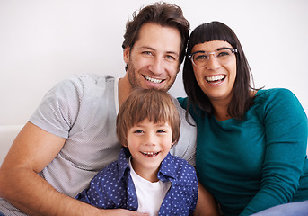 Image showing Happy family, portrait and love on sofa to relax, weekend and bonding together in living room. Parents, children and smile face for affection in trust and care on school vacation to embrace in house