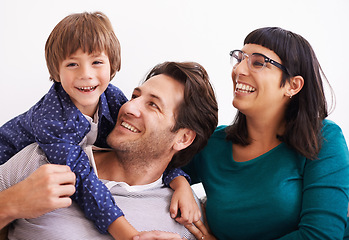 Image showing Happy family, portrait and love on sofa to relax, weekend and bonding together in living room. Parents, boy child and smile face for affection in trust, embrace and parent support on vacation in home