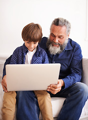 Image showing Grandfather, son and laptop on sofa with love and bonding together with online games in living room. Happy family, boy and computer for cartoons in lounge, relax and movie subscription on holiday