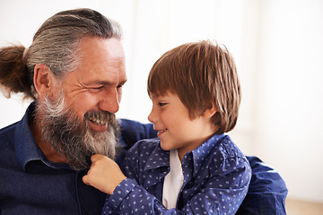 Image showing Smile, grandfather and boy with beard and playing, bonding and relax in living room. Happy family, play and fun with grandpa and pulling facial hair, embrace and caring cuddle with love in lounge