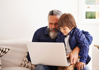 Image showing Grandfather, laptop and boy child for games, elearning and bonding in living room. Kids, family and internet for play or learning online, childhood development and streaming on technology for learn