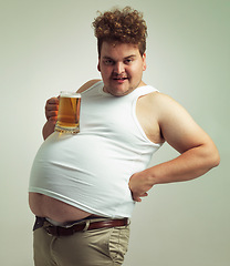 Image showing Obese, weight gain and lager for man in studio with drink for unhealthy habit, plus size and joke. Overweight person with glass on fat stomach for balance, drunk and humor for alcohol and comic