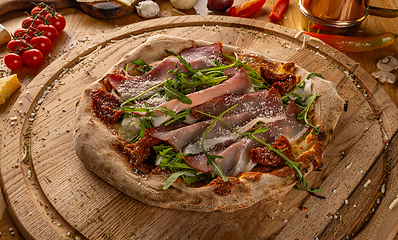 Image showing Artisan pizza with sun dried tomatoes