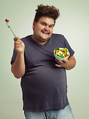 Image showing Studio, portrait and overweight man with salad for weight loss, diet and healthy meal with nutrition. Obese, male person and smile with organic food for detox, lifestyle change and vitamin c benefits