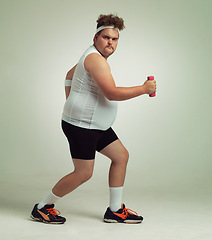 Image showing Man, lunge and dumbbell in studio for portrait, plus size and exercise for weight loss on background. Male person, training and gym equipment for strength, challenge and body development in workout