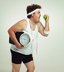 Image showing Scale, man and apple for health, fitness or nutrition isolated on a gray studio background mockup. Plus size, eating fruit and healthy diet for weight loss of body of funny person with tape measure