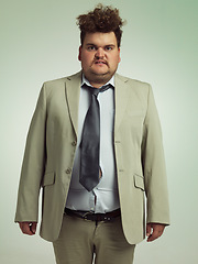 Image showing Plus size, portrait and man with stomach, shirt and professional annoyed with clothes for work. Adult, male person and guy with moody, unhappy and upset with fitting of belly in suit in studio job