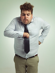 Image showing Plus size, sick and man with vomit, abdomen and unhealthy with double chin, stomach and fat in body. Ill, male person and guy retching in studio, professional and suit for work, adult and employee