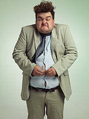 Image showing Overweight, portrait and man fitting in shirt, studio and employee with stomach for clothes. Plus size, male person and guy with obesity unhappy with fat of belly in suit for professional job