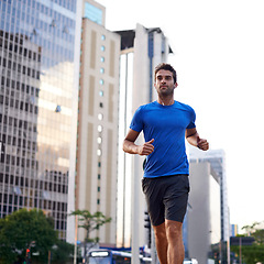 Image showing Fitness, health and man running in city training for marathon, competition or race. Exercise, wellness and male athlete with outdoor cardio workout for endurance, energy or speed in urban town