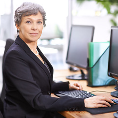 Image showing Business woman, portrait and senior professional in office with manager at computer with a smile for digital work. Tech, desk and happy executive with online job and confidence from accountant career