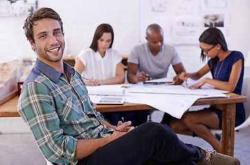 Image showing Happy man, creative and portrait with team for meeting, planning or architectural design at office. Employee or architect with smile, documents or paperwork in group project or startup at workplace