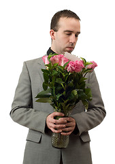 Image showing Man Smelling Roses