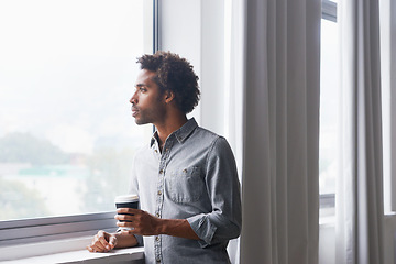 Image showing Man, coffee and thinking by window in new home with confidence for real estate investment and mortgage. African homeowner, person and thoughtful with future house ideas and relocation in living room