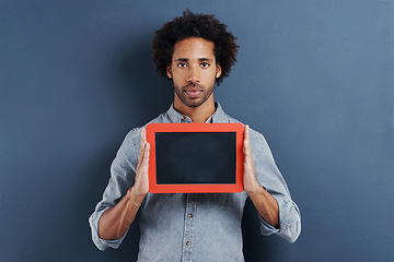 Image showing Portrait, man or blackboard with mockup in studio for news, announcement or offer on blue background. Frame, presentation or face of guy model show space for promotion, info or sign up, guide or deal