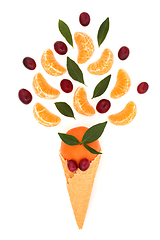 Image showing Surreal Ice Cream Cone Cranberry and Tangerine Fruit Concept