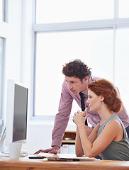 Image showing Business people, teamwork and support on computer for training, advice or feedback on copywriting or project. Professional editor, leader or man and woman reading on desktop of report or editing