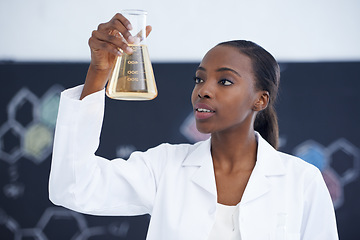 Image showing Scientist, woman and beaker with chemical for study, medical research and pharmaceutical experiment in laboratory. Science, african professional and solution for expert clinical investigation at work