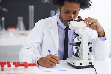 Image showing Research, microscope and man scientist writing in notebook in office for medical, experiment or inspection. Science, healthcare and African health expert with virus study, testing or dna analysis
