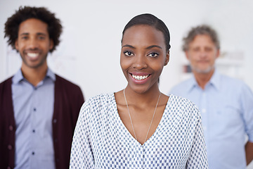 Image showing Woman, smile and portrait in office with colleagues for collaborartion, research and career for organisation, agency or company. Diverse, team and coworkers for planning, teamwork and profession