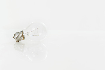 Image showing Lightbulb, electricity and energy for light, power and glass on white background isolated. Ideas, thinking and solution for abstract with base cap, screw in and voltage for lighting equipment