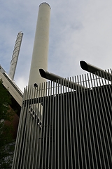 Image showing industrial building and two pipes