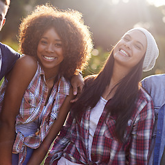 Image showing Portrait, friends and smile with woman in nature for adventure, vacation and weekend trip outdoors. Happiness, lens flare and face of diverse people in sunshine for bonding, holiday and travel