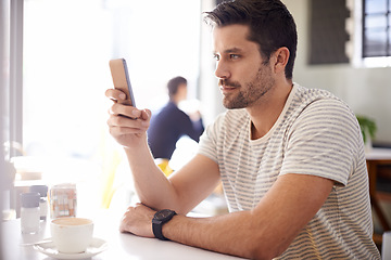 Image showing Man in cafe, smartphone and scroll on social media, reading on mobile app or ebook with communication and contact. Chat, email or text message with tech, search internet and online at coffee shop