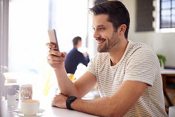Image showing Happy man, relax at cafe with smartphone and scroll online for social media, tech and communication. Chat, reading on app or ebook with break at coffee shop, contact and using phone with network