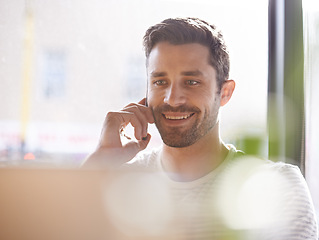 Image showing Remote work, phone call and man with laptop, smile and networking on chat for creative professional. Computer, research and happy freelancer with online job, cellphone and consulting on web project