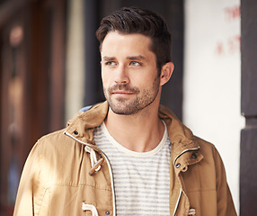 Image showing Man, face or serious in city with fashion by cafe with urban style, trendy outfit and confidence or pride. Male person, thinking or relax outdoor in town with wellness, casual clothes or morning trip