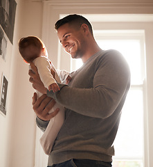 Image showing Father, baby and bonding with happiness and love, growth and child development with joy at family home. Man, infant or newborn with smile and dad holding kid for comfort, childhood and parenting