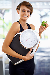 Image showing Portrait, scale and happy woman eating apple for diet, nutrition or wellness with healthy body after exercise. Weight loss, smile and person with green fruit, vitamin c or organic food for fitness