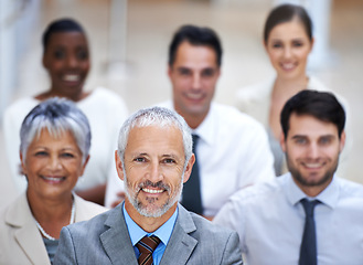 Image showing Portrait, leadership and group of business people with senior manager, confidence and smile at startup. Solidarity, professional men and women together in office with teamwork, pride and trust in CEO