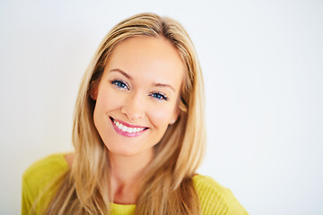 Image showing Portrait, smile and woman in a house with confidence, positive attitude and feel good mood on white wall background. Face, happy and female person at home with optimism, relax and chilling on weekend