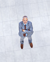 Image showing High angle, portrait and happy man with arms crossed in business or office with confidence and pride. Mature, entrepreneur and above person in lobby excited for morning in London at workplace