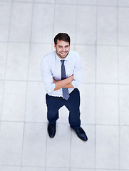 Image showing Business, man and high angle portrait with arms crossed in office with confidence and pride. Above, entrepreneur and person in lobby to start morning in corporate London workplace with perspective