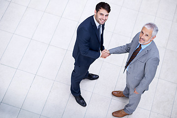 Image showing Portrait, handshake and smile of business people with CEO for deal, collaboration or b2b partnership agreement for consultant. Top view, shaking hands or men in office for acquisition on mockup space
