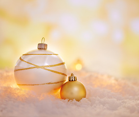 Image showing Christmas, lights and balls for decoration on snow with mockup space in winter on a background closeup. Xmas, cold weather and festive sphere, baubles or ornaments for holiday celebration at party