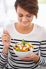 Image showing Happy woman, diet and salad or eating healthy food for detox, breakfast and lunch at home. A young person with green fruits, vegetables and lettuce or vegan meal in bowl for nutrition and wellness