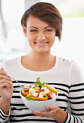 Image showing Woman, diet and salad in portrait with healthy food for detox, breakfast and lunch at home. Young person eating green fruits, vegetables and lettuce or vegan meal in bowl for nutrition and wellness
