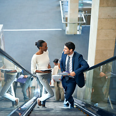 Image showing Teamwork, talking or business people on escalator for meeting, travel or paperwork in workplace. Diversity, documents and workers planning for collaboration or project together in office conversation