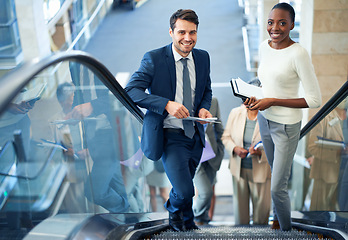 Image showing Teamwork, portrait or business people on escalator for meeting, travel or paperwork in workplace. Diversity, document or happy workers planning for collaboration, report or project together in office